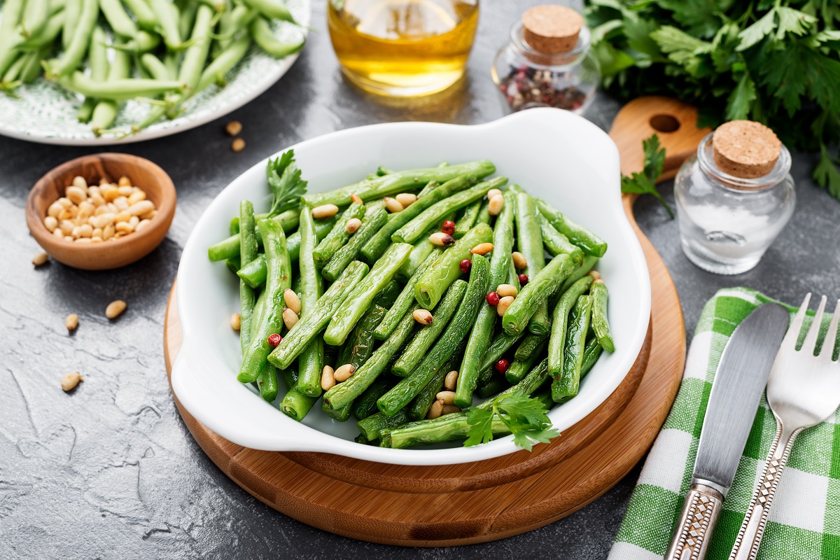 Sauteed,Green,Beans,With,Pine,Nuts,In,A,Baking,Dish,