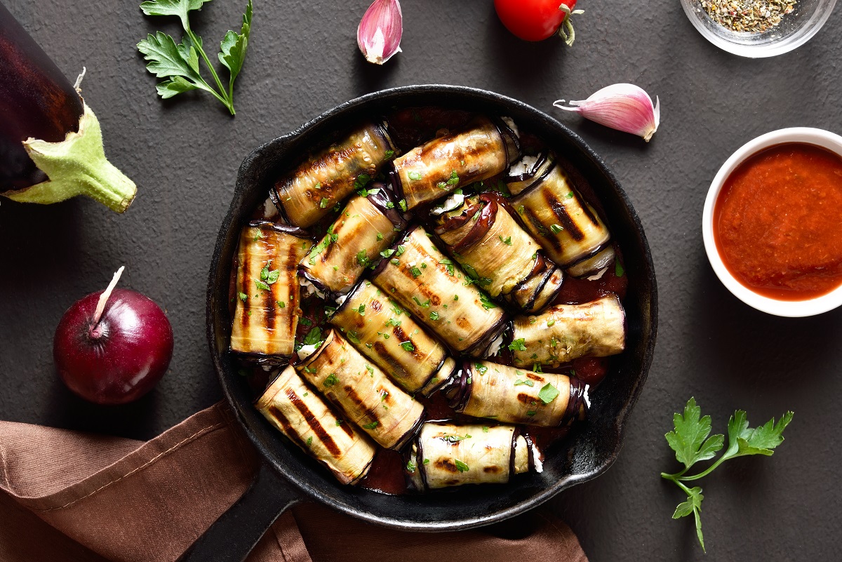 Eggplant,(aubergine),Rolls,With,Cheese,And,Greens,In,Frying,Pan