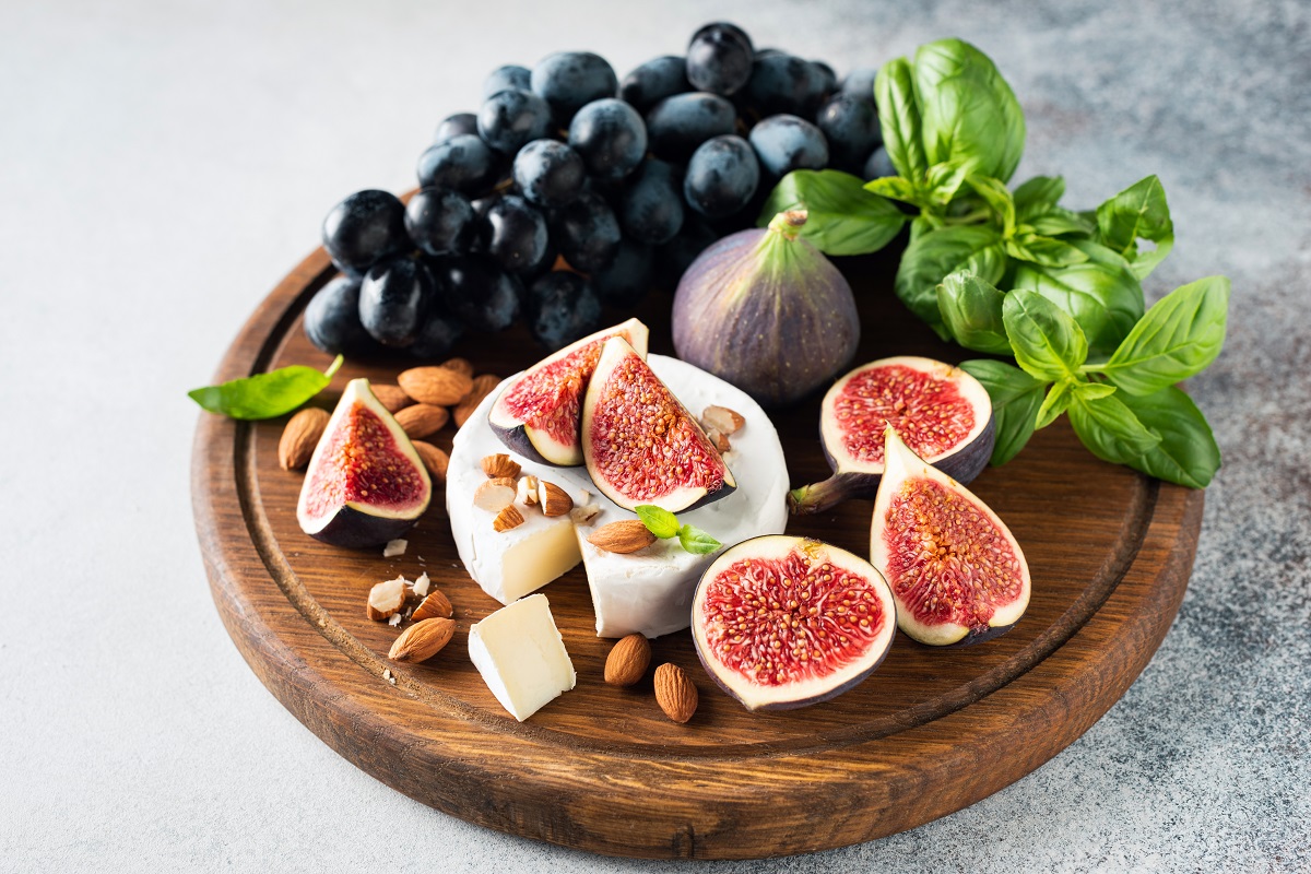 Cheese,Board,With,Camembert,,Figs,,Grapes,And,Nuts.,Appetizer,Plate,
