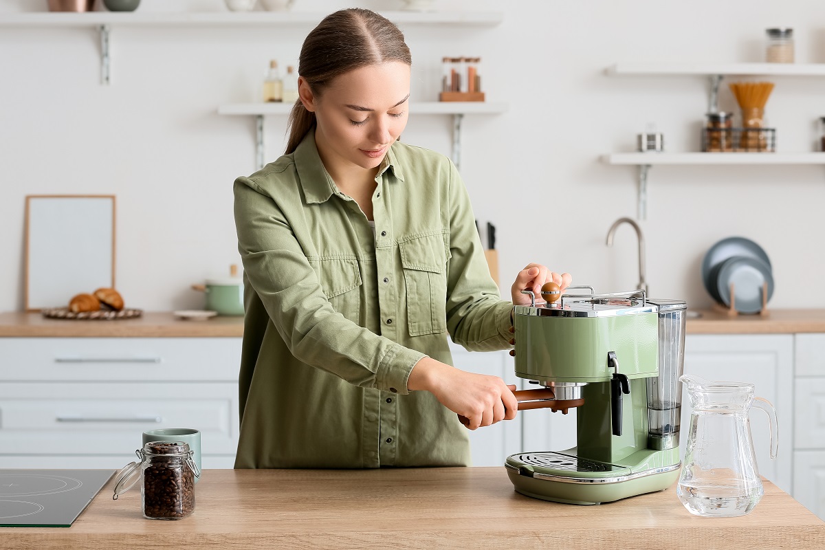 Young,Woman,Making,Tasty,Coffee,In,Kitchen