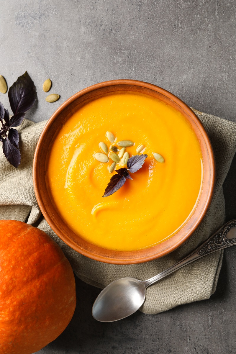 Flat,Lay,Composition,With,Bowl,Of,Pumpkin,Soup,On,Gray