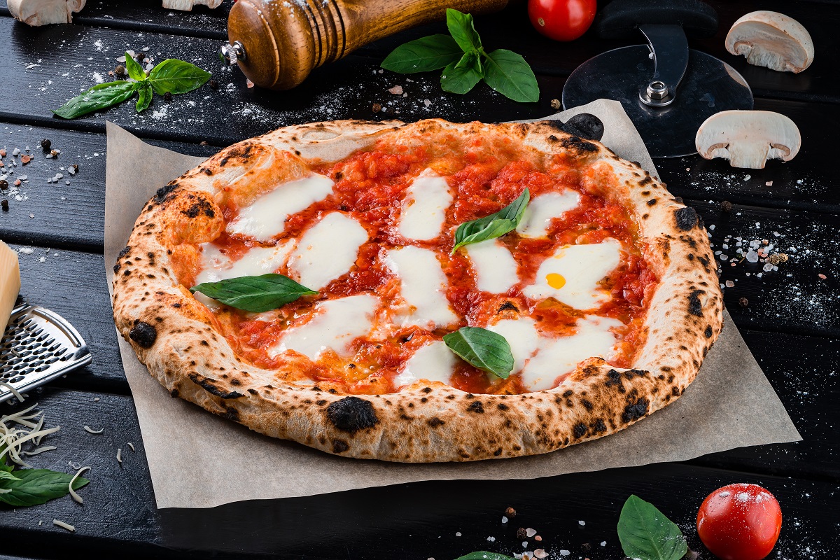 Neapolitan,Pizza,With,Spices,,Tomatoes,And,Cheese,Mozzarella,On,Dark