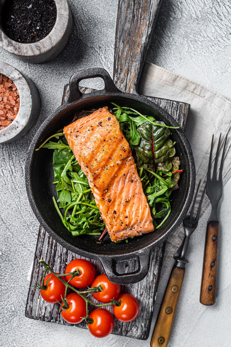 Salmon,Fillets,,Grilled,Steaks,In,Skillet,With,Herbs.,White,Background.