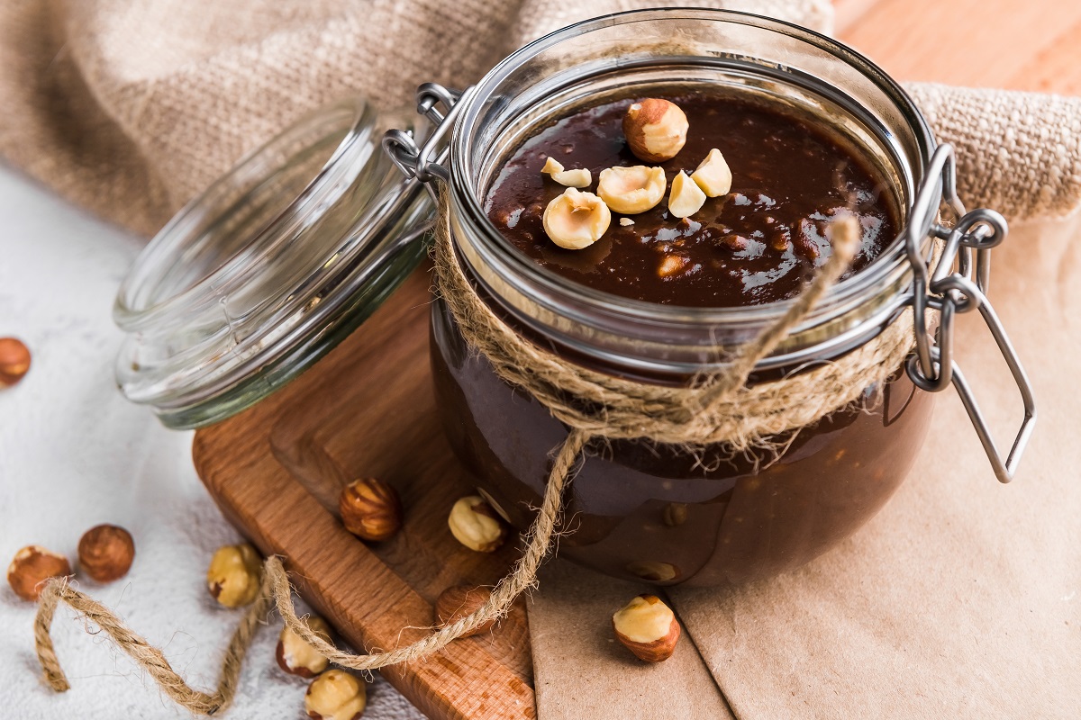 Homemade,Nutella,In,A,Glass,Jar,Sprinkled,With,Hazelnuts,On