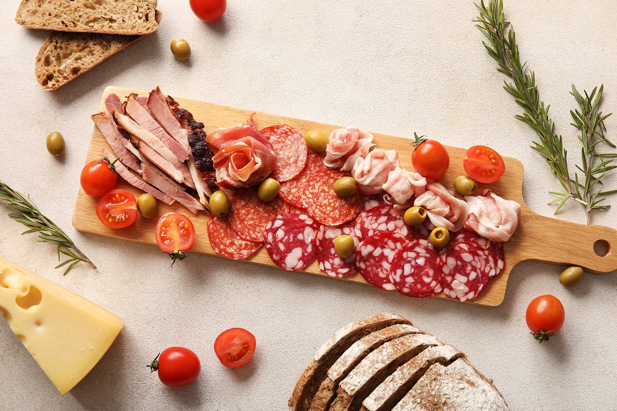 Wooden,Board,With,Assortment,Of,Tasty,Deli,Meats,And,Bread